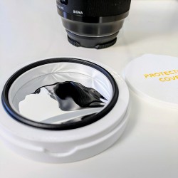 Close-up view of the integrated aluminum threaded ring on the camera lens solar filter cell mount.
