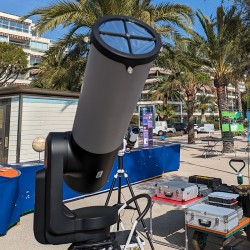 Public solar observation outreach event using a Unistellar eVscope with custom solar filter mount.